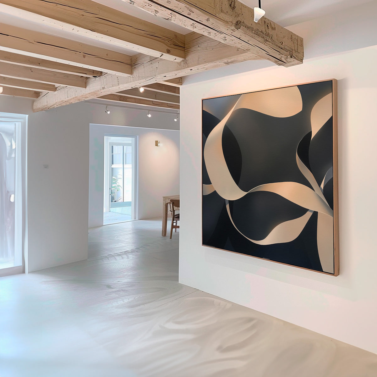 A modern, minimal art gallery with white walls displays the Quiet Division Abstract Canvas Art—featuring beige and black swirling shapes. Light wood beams and natural light enhance the elegant, contemporary space.