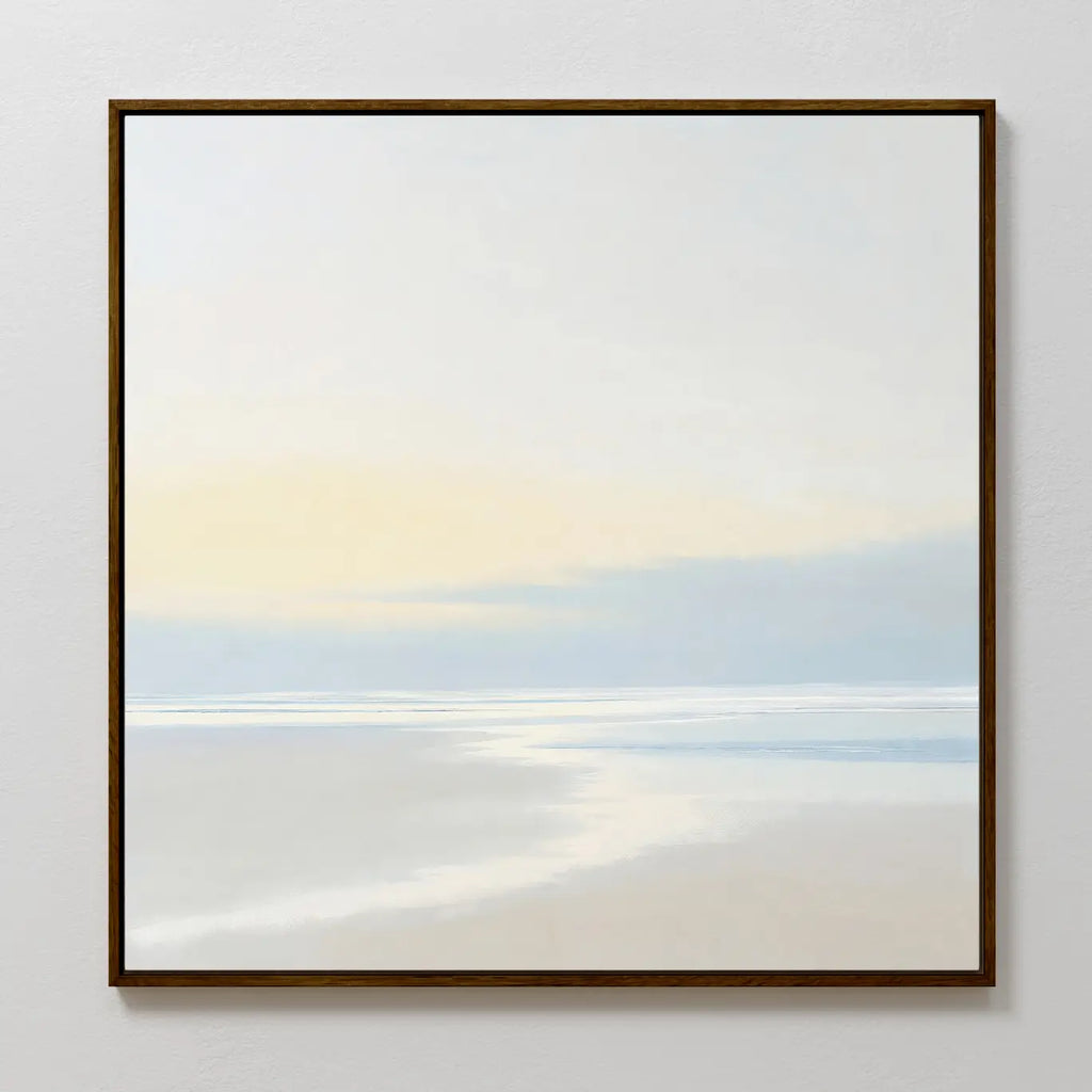 Quiet Shores Canvas Art features a minimalist seascape in soft pastels—a pale sky, gentle clouds, and smooth water reflections in a dark frame—making it the perfect wall art for serene coastal decor.