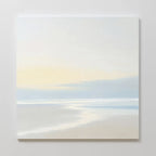 Quiet Shores Canvas Art features a minimalist seascape in soft pastels with calm water, a sandy shore, and a pale sky at sunrise or sunset—ideal for coastal decor and adding a peaceful touch to any space.