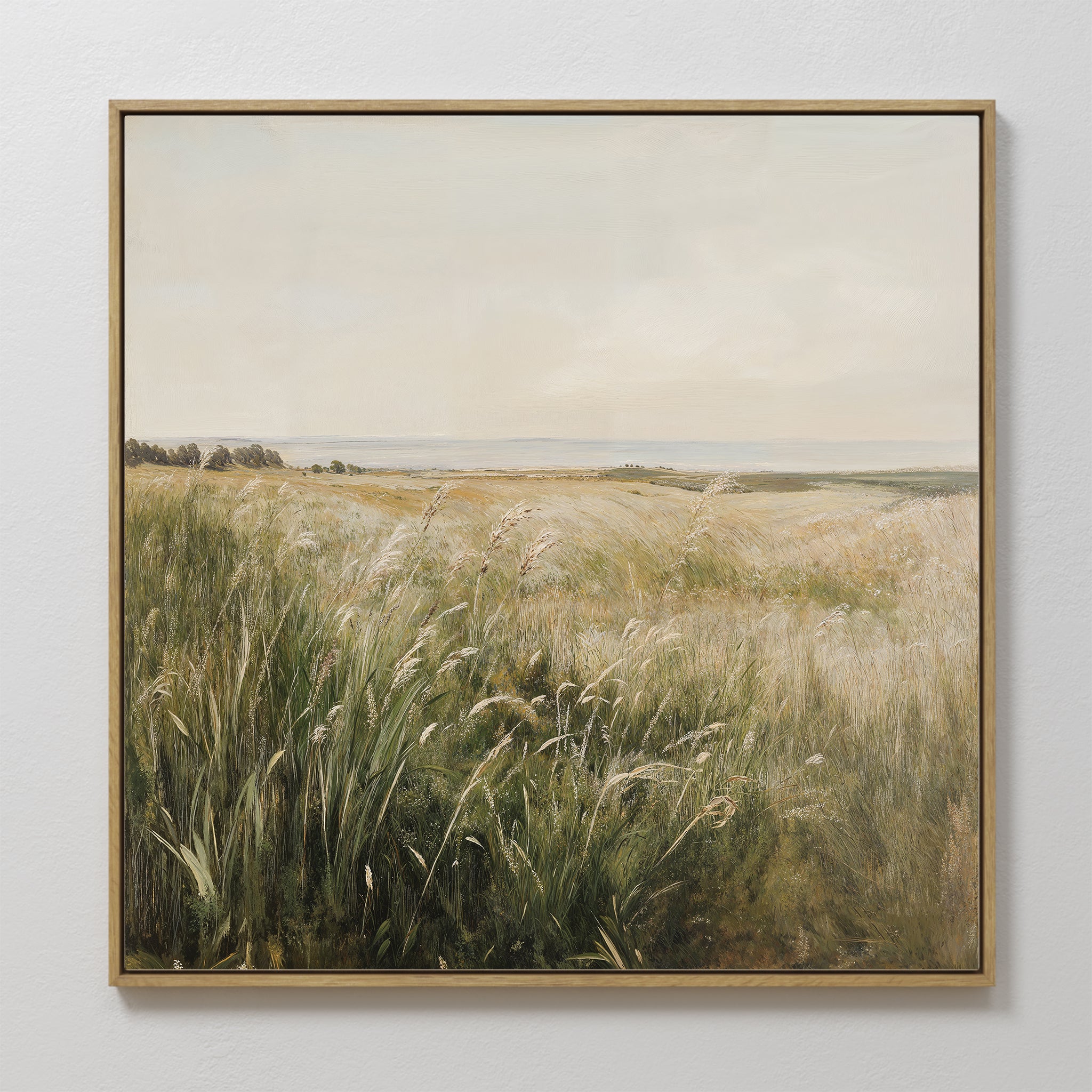 The Reeds by the River Canvas Art is a framed minimalist painting featuring sunlit wild grasses, distant trees, and a pale sky—perfect wall art print for living room decor.