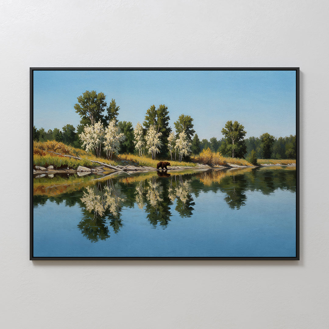 Reflections of the Wild Canvas Art features a brown bear by a calm river, with trees, rocks, and sky reflected in the water—an ideal minimalist wall decor piece for nature lovers.
