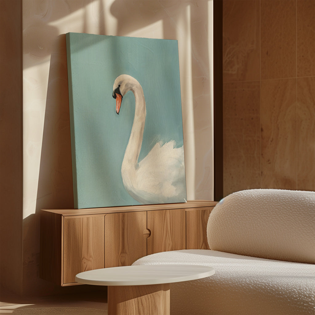 The Regal Swan Canvas Art, featuring a white swan on blue, rests on a wooden console next to a white textured sofa and round table in a sunlit modern room with beige walls.