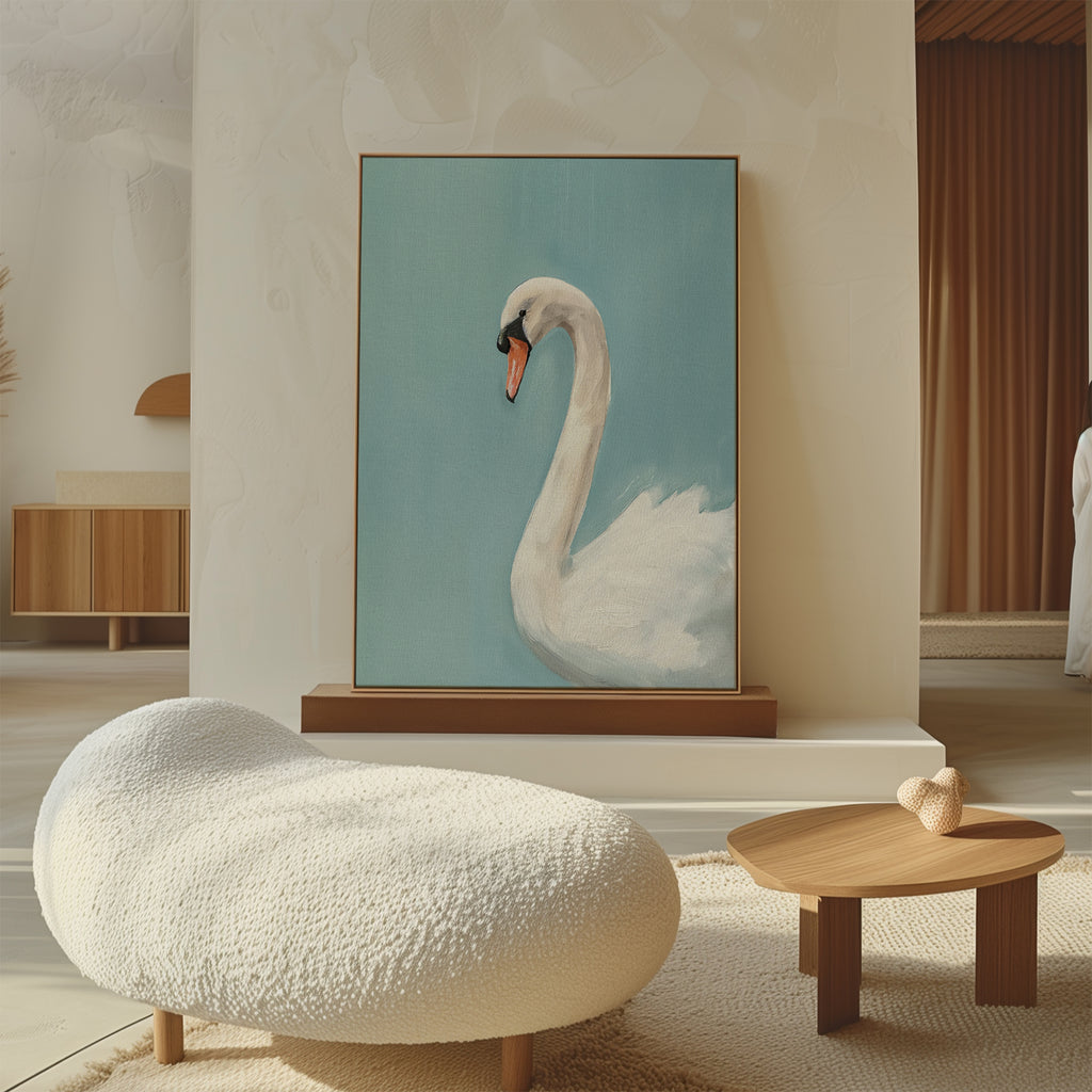 A cozy modern room features a textured white lounge chair, a small wooden coffee table, and the Regal Swan Canvas Art—a large framed painting with a blue background—leaning against the wall. Warm, neutral tones enhance the decor.