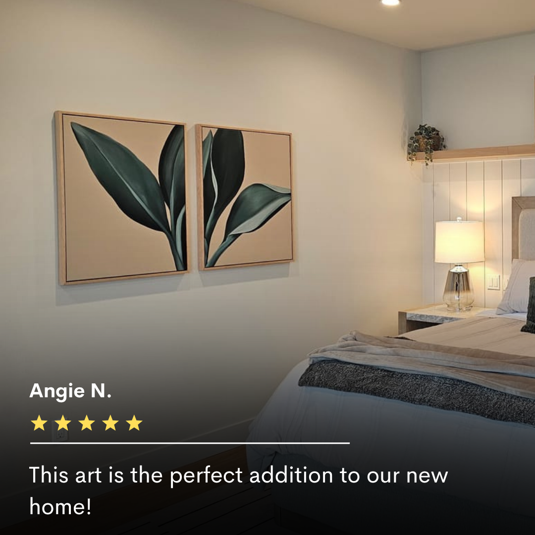 A modern bedroom with a neatly made bed, bedside table with a lit lamp, and the Emerald Poise Set of 2 wall art featuring green leaves. The softly lit space exudes a cozy, contemporary vibe.