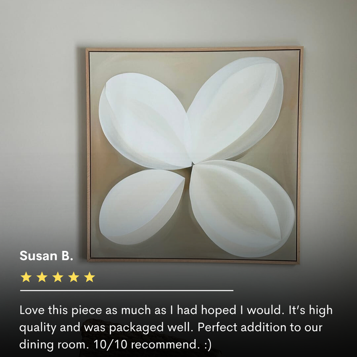 Clover Harmony Abstract Canvas Art features four overlapping white petal-like shapes on a beige background, framed in light wood for modern living room decor. A five-star review is displayed below the artwork.