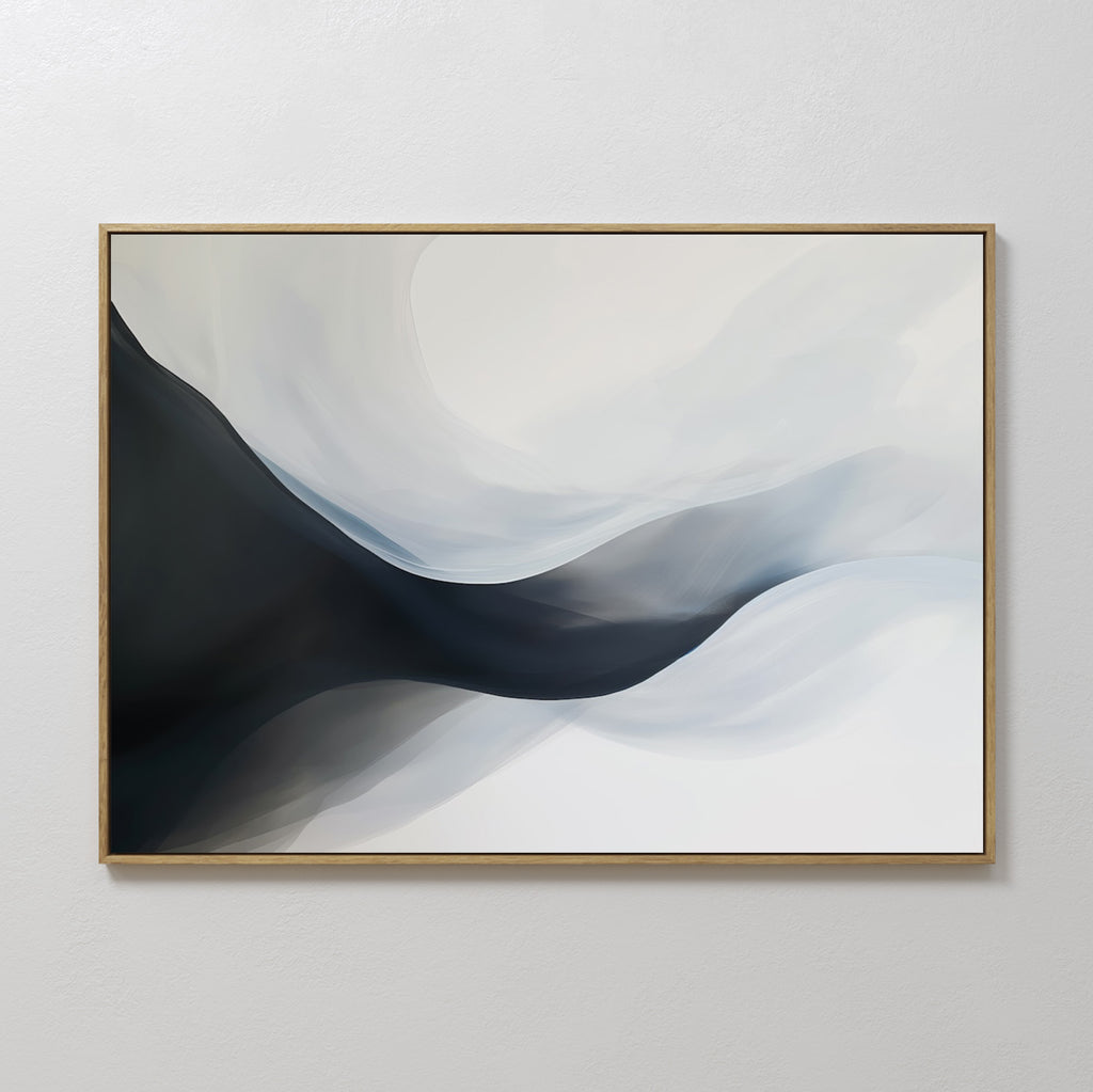 Rippling Vista Abstract Canvas Art features flowing black, gray, and white shapes for a modern, minimalist look. Framed with a thin gold edge and displayed on a light wall, it adds elegant movement to your decor.