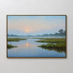 The Rising Stillness Canvas Art is a framed painting of a serene wetland sunrise, featuring grassy islands, calm water, and white birds in a misty sky—an ideal minimalist touch for tranquil bedroom decor.