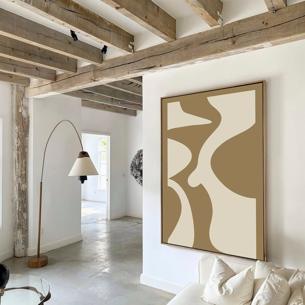 A modern living room with exposed wooden ceiling beams, white walls, the Arctic Lines Abstract Canvas Art above the sofa, a beige-shaded floor lamp, and a white sofa with cushions.