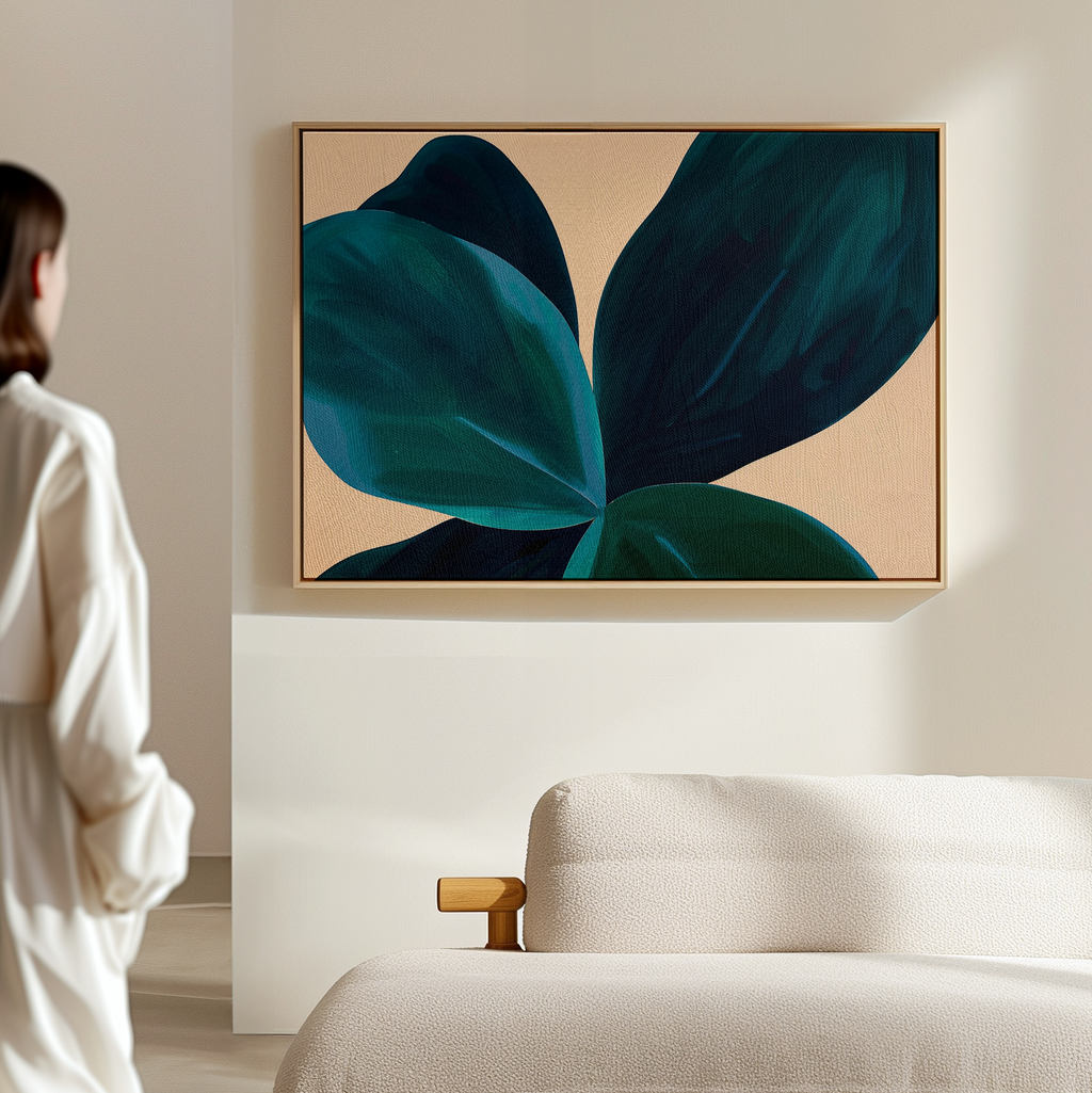 In a minimal, light-filled room, a person admires Deep Navy Abstract Canvas Art displayed above a beige textured sofa, adding elegance and modern style to the living room decor.