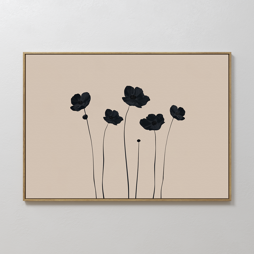 The Botanic Abstract Canvas Art features a minimalist floral print with six black flowers on a beige background, set in a thin gold frame. This modern piece adds elegance to any white textured wall.