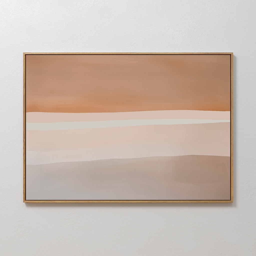 The Saharan Lines Abstract Canvas Art in a gold frame features horizontal bands of beige, tan, rust, and cream, creating a serene statement as large wall art against a crisp white wall.