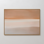 The Saharan Lines Abstract Canvas Art in a gold frame features horizontal bands of beige, tan, rust, and cream, creating a serene statement as large wall art against a crisp white wall.