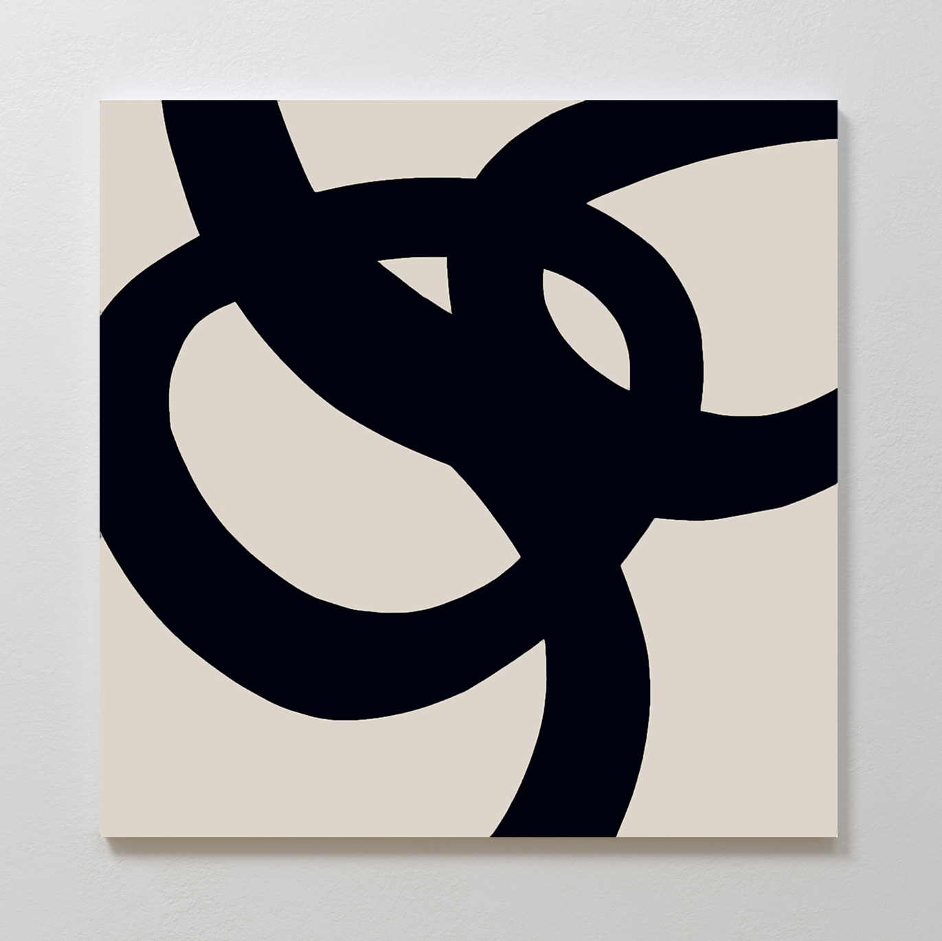 Monochrome Stream Abstract Canvas Art features bold, thick black looping lines on a light beige background. This minimalist wall art adds modern elegance and striking style to any living room decor.