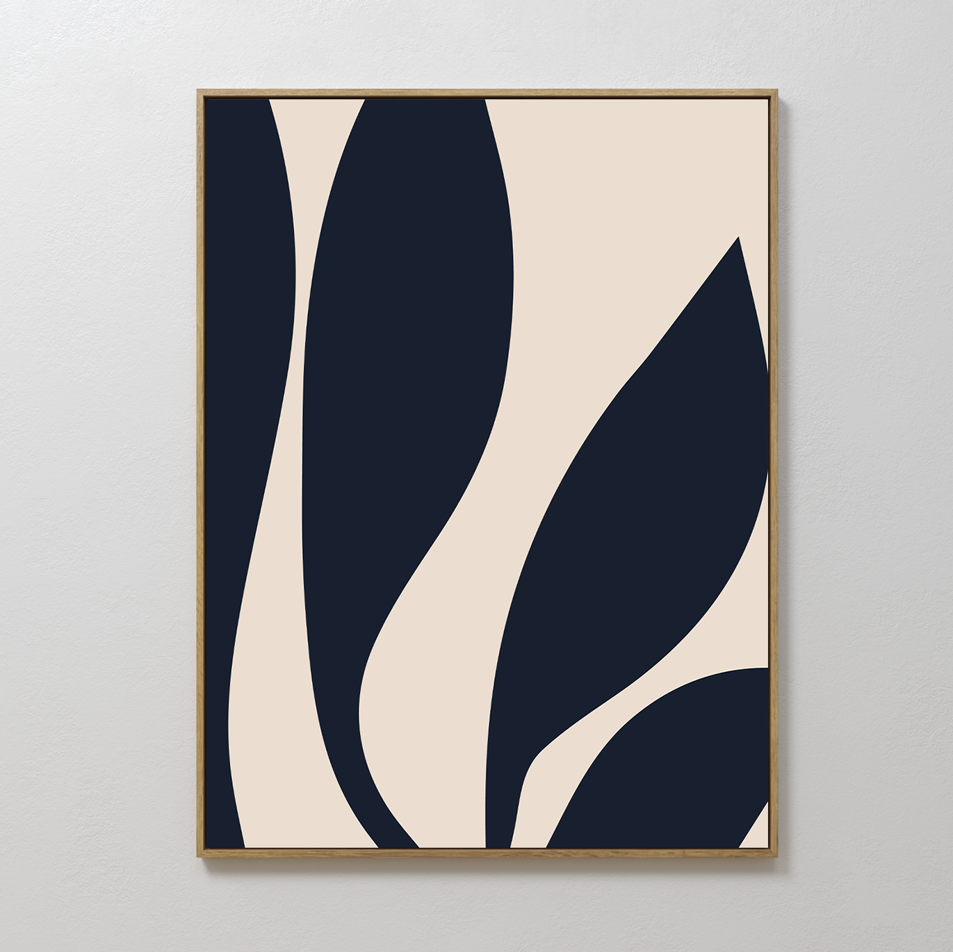 Dark Blue Leaves Abstract Canvas Art features bold, curved navy shapes on a beige background. Framed in simple wood and displayed against a white wall, this piece brings modern elegance and timeless appeal to any space.