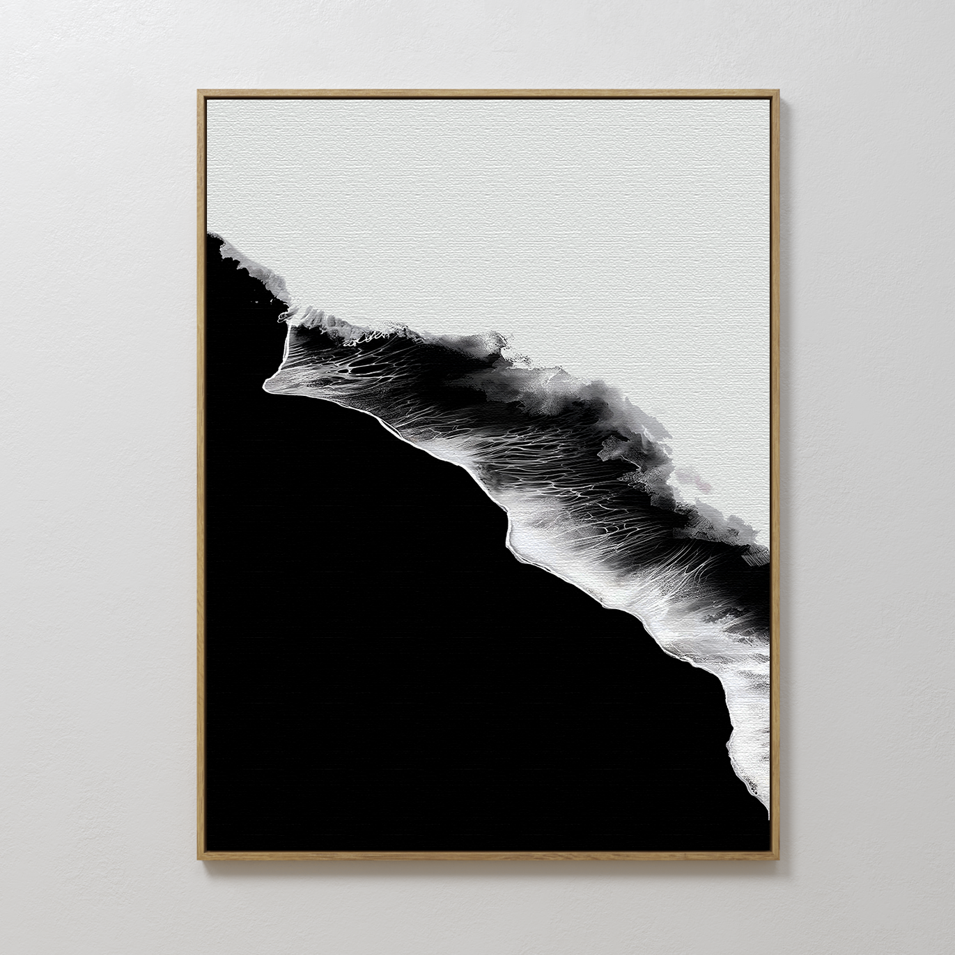 Black Ocean Abstract Canvas Art: A minimalist black and white abstract wave design, printed on textured canvas and framed in a sleek gold frame, enhances any plain white wall with modern elegance.