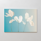 Enhance your living room with the Stellar Flora Abstract Canvas Art—minimalist wall decor featuring three delicate white flowers with thin stems on a gradient blue to beige background.