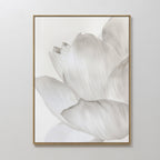 The White Blossom Abstract Canvas Art is a minimalist wall decor featuring a close-up of soft, overlapping white and light gray petals, ideal for enhancing modern living room interiors.