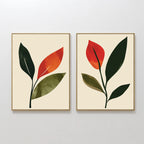 The Rustic Stems Set of 2 features framed minimalist botanical prints with olive green, orange, and red leaves on a beige background—perfect rustic wall art for modern living rooms, shown side by side on a white wall.