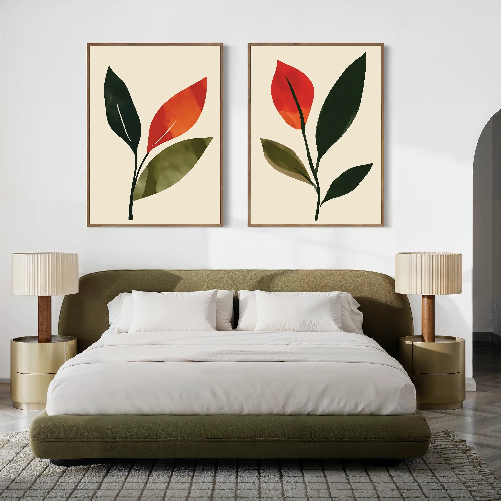 A modern bedroom with an olive green bed, white bedding, two beige nightstands with matching lamps, and two framed Rustic Stems Set of 2 minimalist leaf prints in olive green hanging above the headboard.