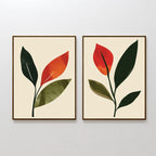 The Rustic Stems Set of 2 features minimalist framed prints with abstract green and orange leaves on a light beige background. Each print displays a single stem with overlapping leaves, ideal for modern living room decor.