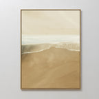 Sand and Sea Abstract Canvas Art—a framed painting of gentle waves on a sandy shore in soft beige, tan, and white tones—makes the perfect minimalist wall art for any neutral home decor.
