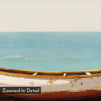 The Sandbound Vessel Canvas Art features a weathered, rusted boat on a calm shore with blue waves and a pale sky. Its soft, painted texture makes it perfect as minimalist wall art or coastal decor, with "Zoomed-In Detail" in the corner.