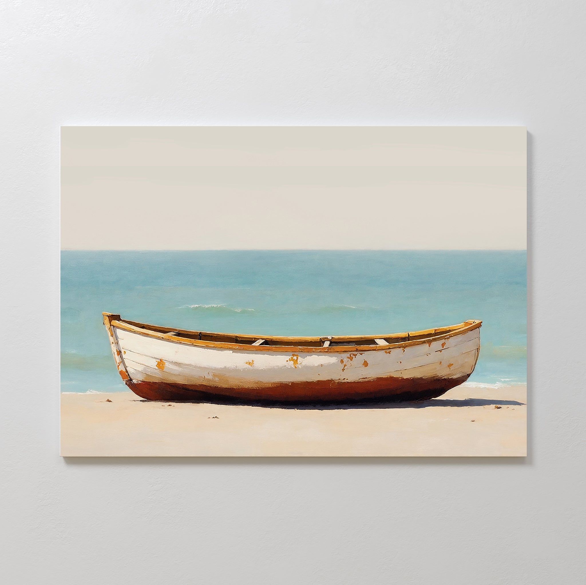 Sandbound Vessel Canvas Art features a white, weathered rowboat on a sandy beach with a calm blue sea and pale sky—ideal coastal wall art for minimalist decor and creating a tranquil atmosphere in any bedroom.