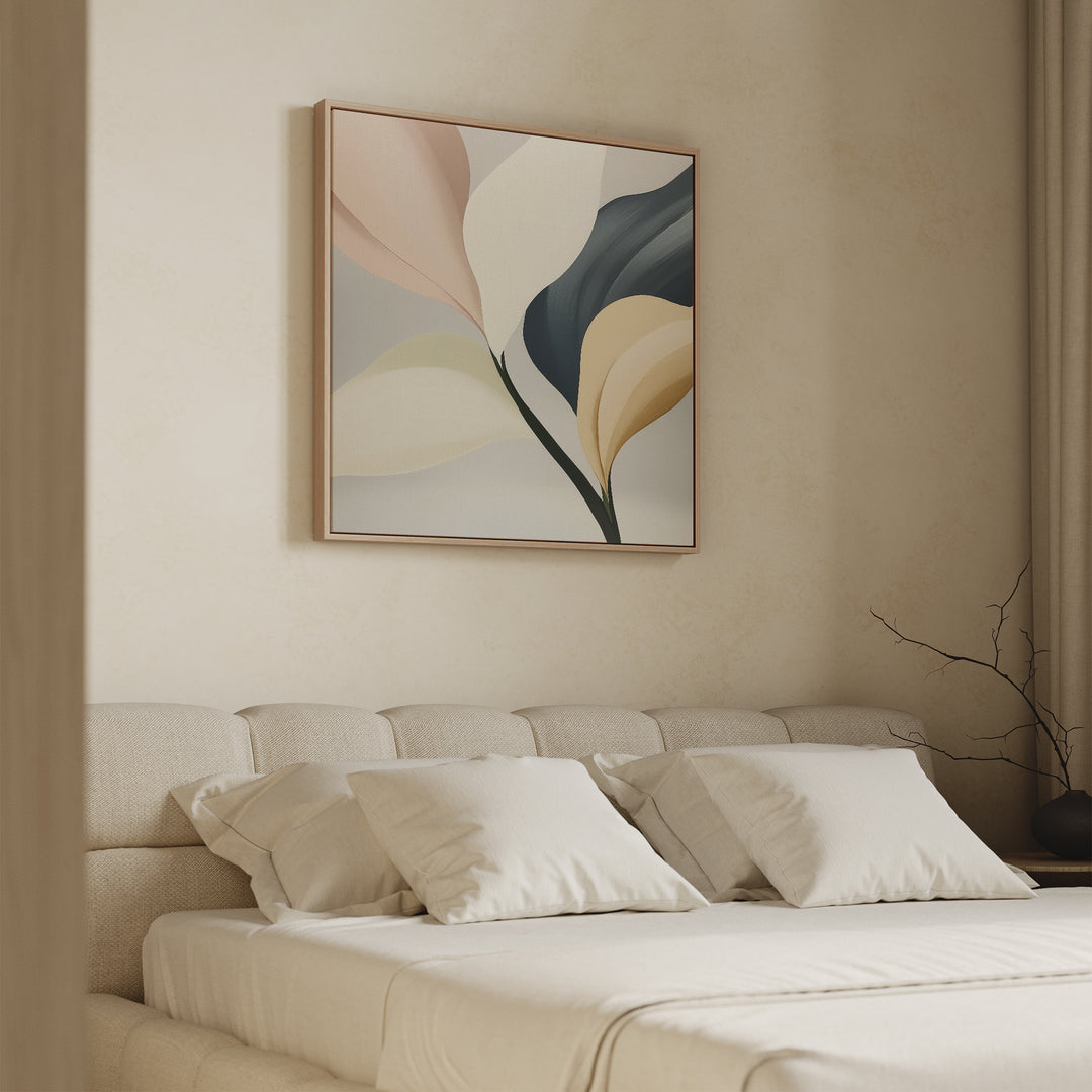 A minimalist bedroom features a beige tufted headboard, crisp white pillows, and Sculpted Elegance Canvas Art in soft pastels above the bed. A bare branch on the side table enhances the serene ambiance.