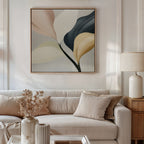 A modern living room with a beige sofa, neutral pillows, a lamp, and dried flowers features Sculpted Elegance Canvas Art—a minimalist botanical piece in muted tones—hung above the couch for an elegant décor accent.