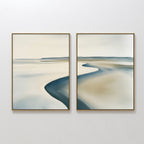 The Serene Coastline Set of 2 features abstract paintings with soft, blurred lines and muted tones of beige, blue, and gray, evoking water, sand, and sky—perfect minimalist wall art for creating a calm coastal vibe.
