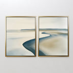 The Serene Coastline Set of 2 features abstract landscape paintings in gold frames, with soft beige, blue, and gray tones that evoke coastal wall art and bring minimalist elegance to any space.