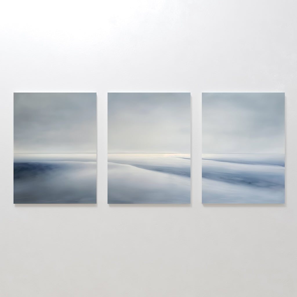 The Serene Horizons Set of 3 features minimalist landscape paintings in soft blue and gray tones, depicting tranquil abstract seascapes or icy terrains—perfect for adding calm and stylish decor to any space.