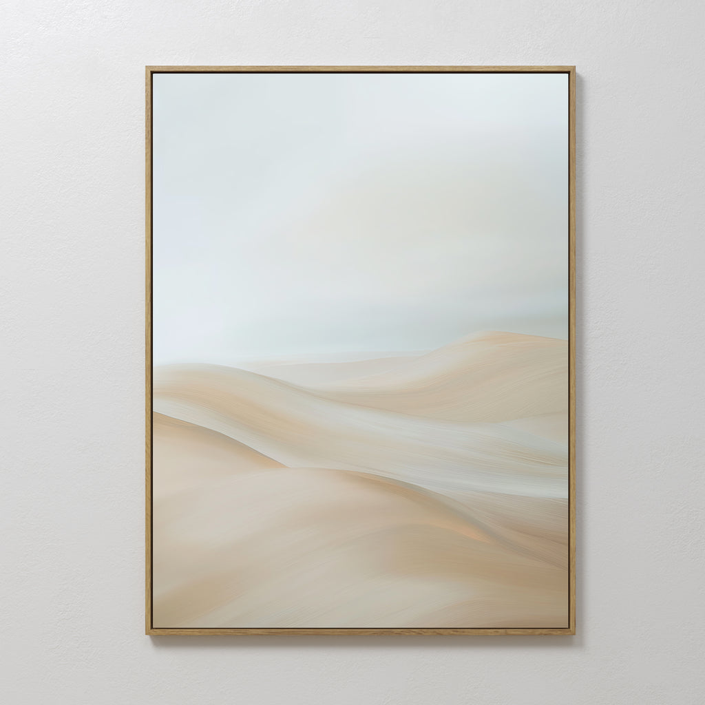 The Serene Peaks Abstract Canvas Art showcases soft, beige sand dunes beneath a pale, cloudy sky in a simple wooden frame. Its smooth lines and calming neutral colors make it perfect wall art for a tranquil space.