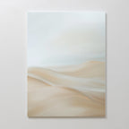 The Serene Peaks Abstract Canvas Art showcases soft, blurred beige and cream tones reminiscent of gentle sand dunes beneath a pale sky, creating a minimalist look when displayed on a plain white wall.