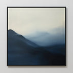 The Shadowed Valley Canvas Art, featuring misty mountains in blue and gray tones with soft, blurred gradients, creates a calming abstract landscape—perfect minimalist wall decor for a serene space.
