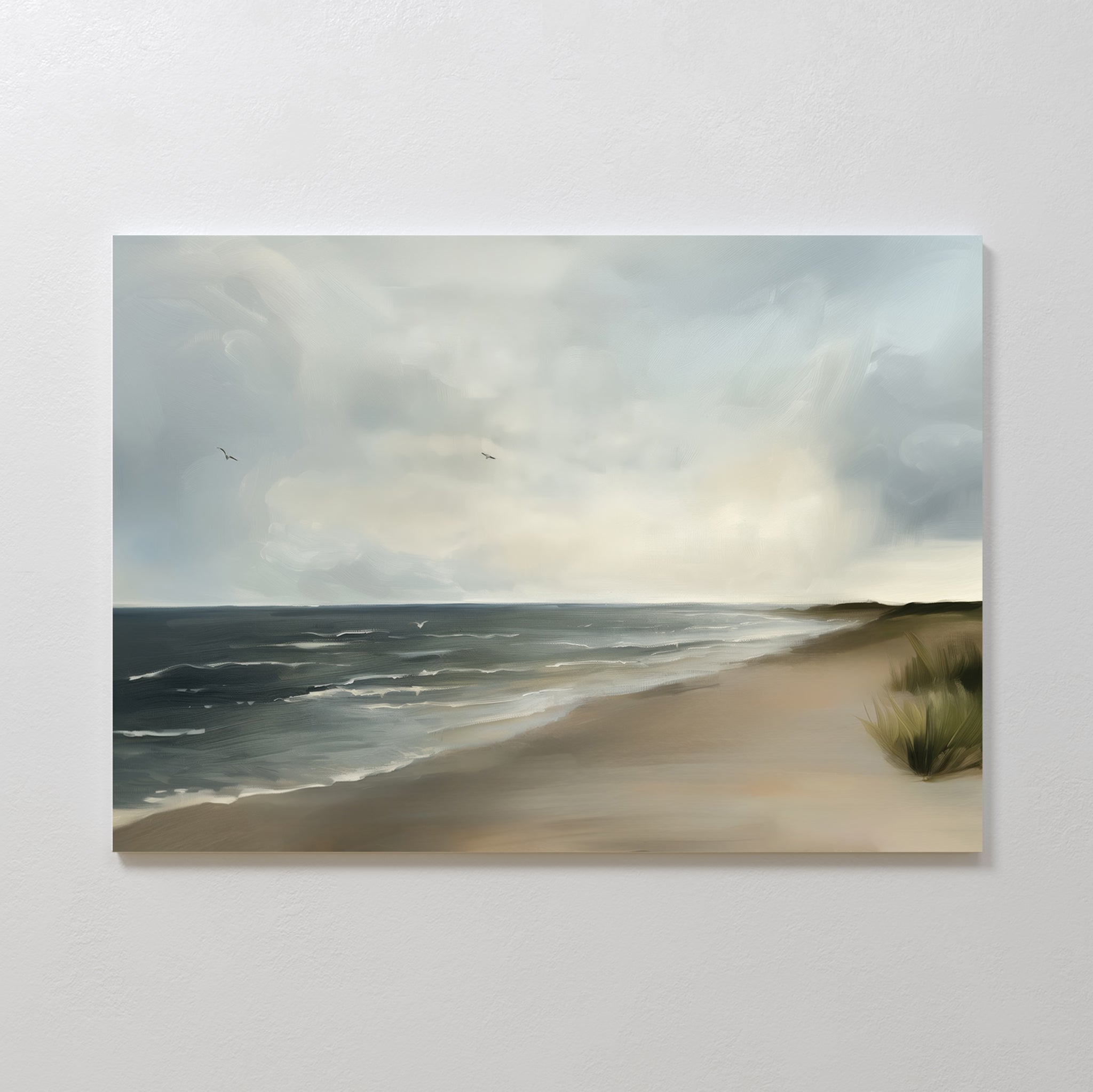 Shoreline Calm Canvas Art captures a peaceful beach with gentle waves, dune grass, and two birds in a gray-blue sky—ideal wall décor for enhancing any coastal-themed space.