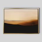 Sienna Ridge Canvas Art features a framed abstract landscape in soft gold, brown, and black tones, evoking a sunrise or sunset over rolling hills—ideal minimalist wall art for modern living room decor.