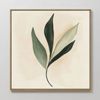 Silent Leaf Canvas Art features a minimalist design with four elongated green leaflets in varied shades on a beige background, framed in thin gold. An elegant botanical wall art piece perfect for modern decor.