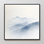 Silent Summits Canvas Art features minimalist blue and gray mountains fading into mist, with soft gradients. Framed in thin black, it makes ideal modern bedroom decor on light-colored walls.