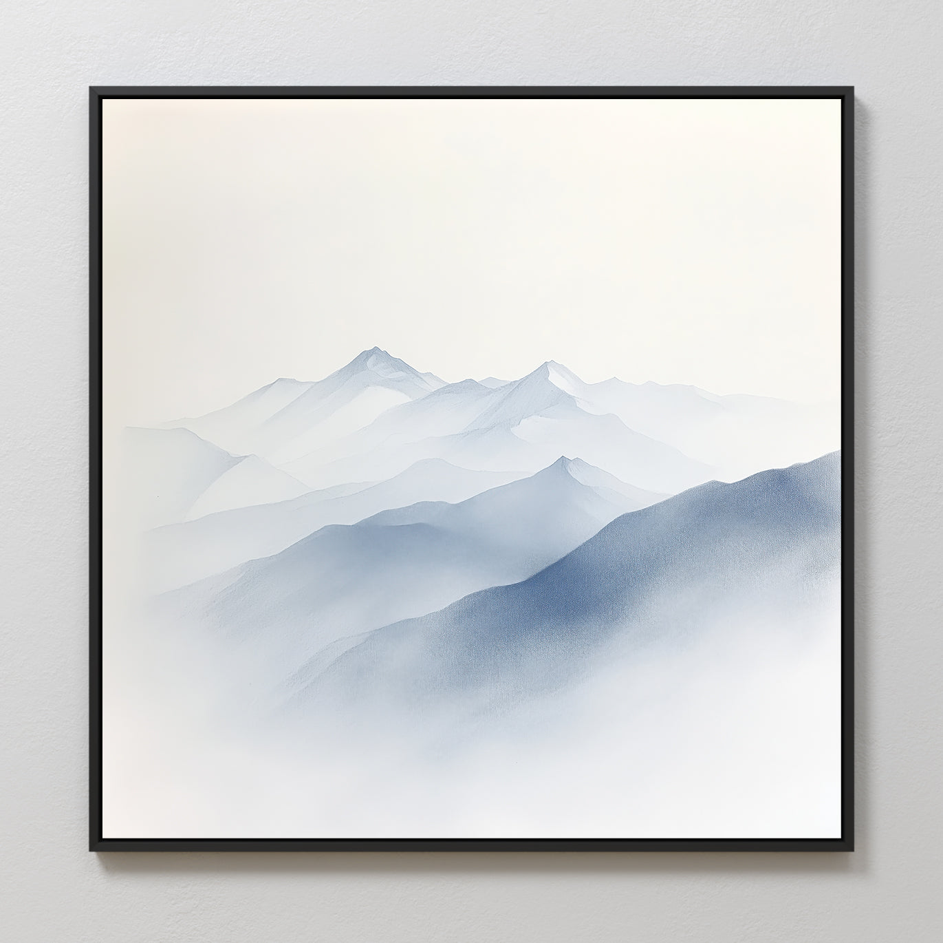 Silent Summits Canvas Art features minimalist blue and gray mountains fading into mist, with soft gradients. Framed in thin black, it makes ideal modern bedroom decor on light-colored walls.