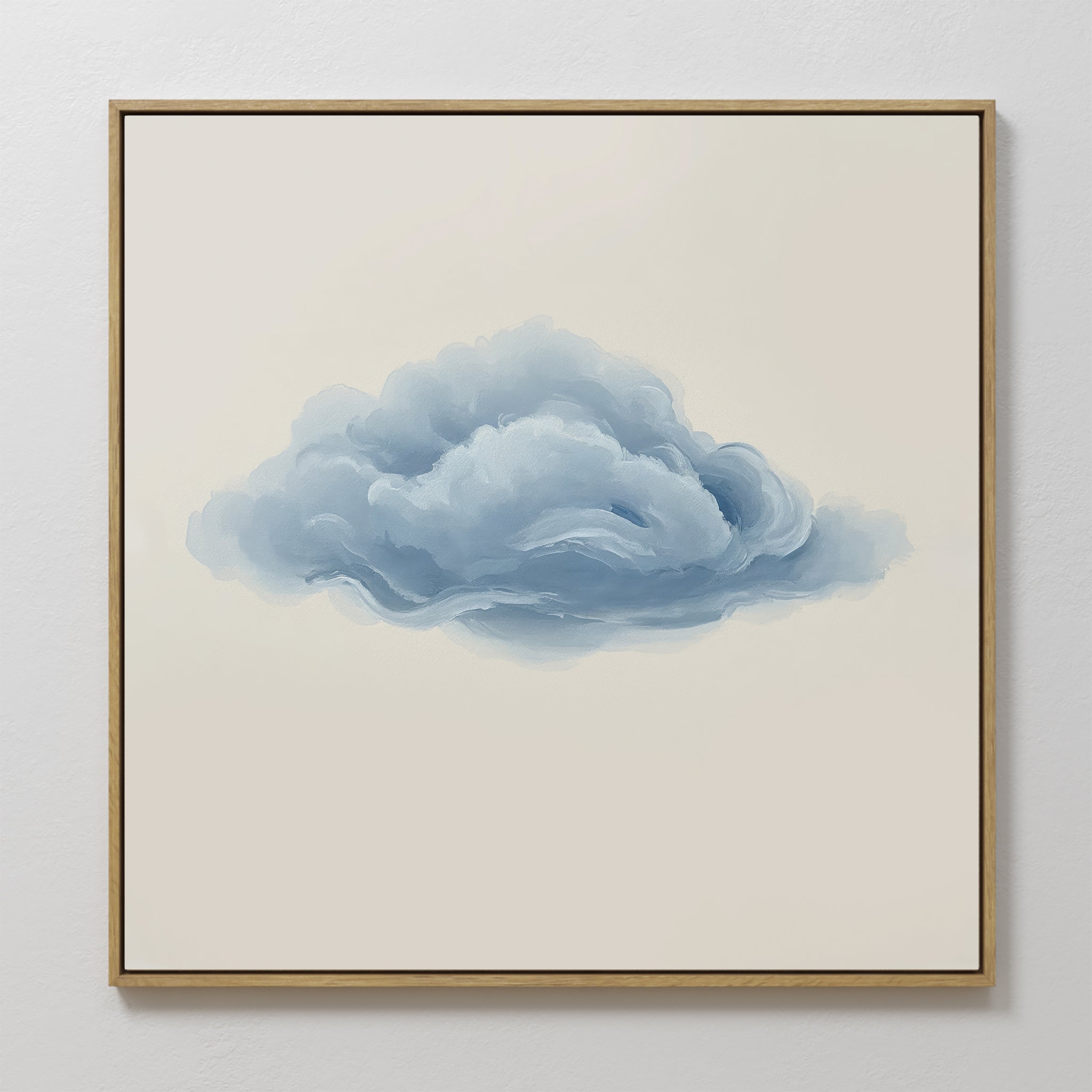 Single Cloud Canvas Art features a framed painting of a fluffy blue-gray cloud on a beige background, bringing modern minimalist style and a soft accent to any white wall.