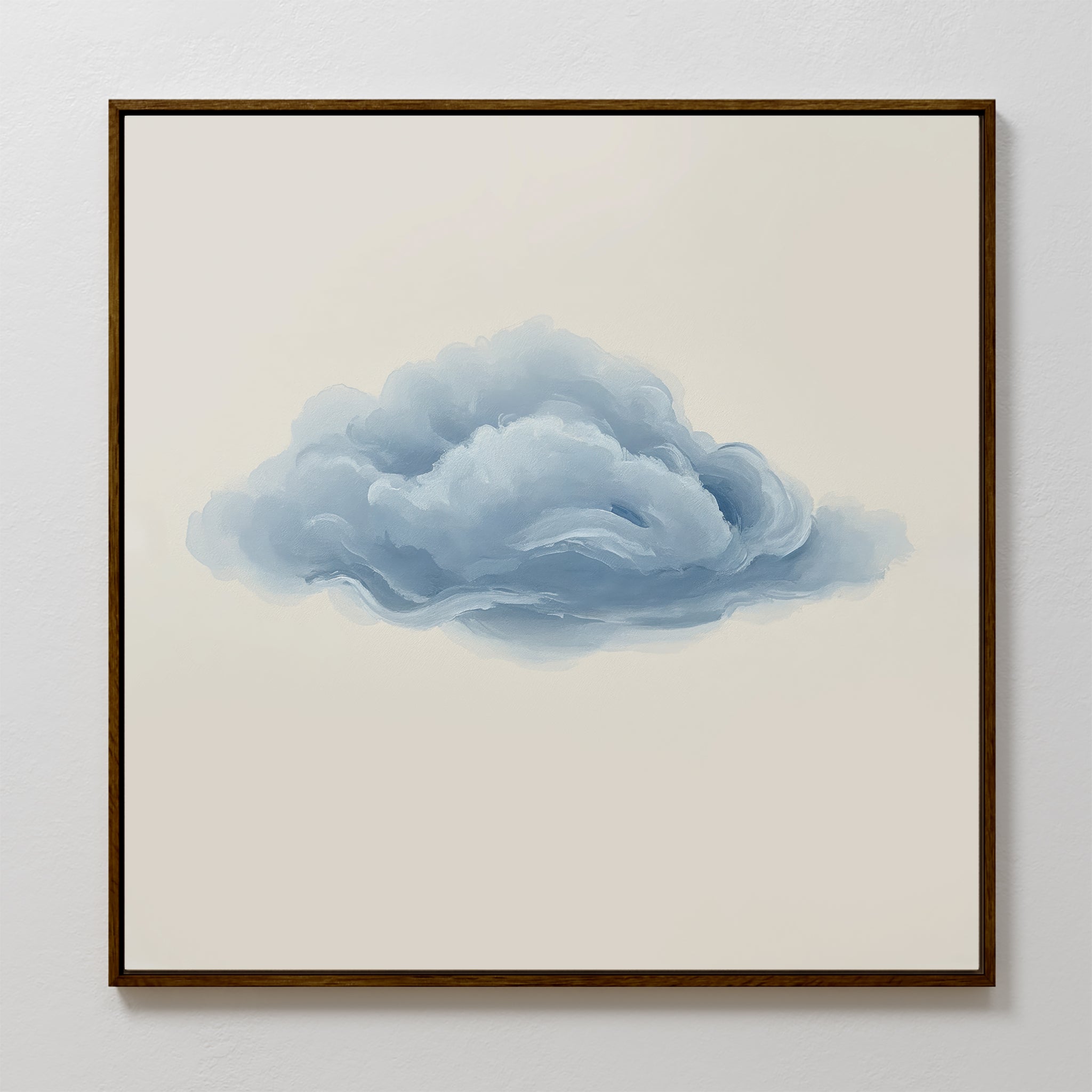 The Single Cloud Canvas Art displays a fluffy blue-gray cloud on a beige background, framed and perfect for adding minimalist charm to modern decor. Looks elegant when displayed on a white wall.