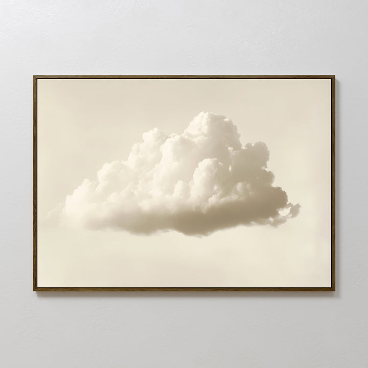 The Singular Vapor Canvas Art – Horizontal features a single fluffy white cloud on a pale background, ideal minimalist wall art for modern interiors or serene bedrooms, shown mounted on a plain white wall.