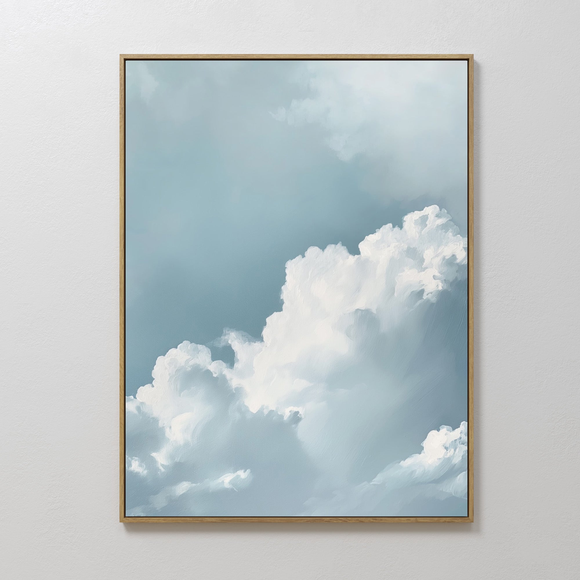 Sky Serenade Abstract Canvas Art features fluffy white clouds on a soft blue sky, framed and ready to hang—a perfect minimalist wall art piece to enhance your living room decor.