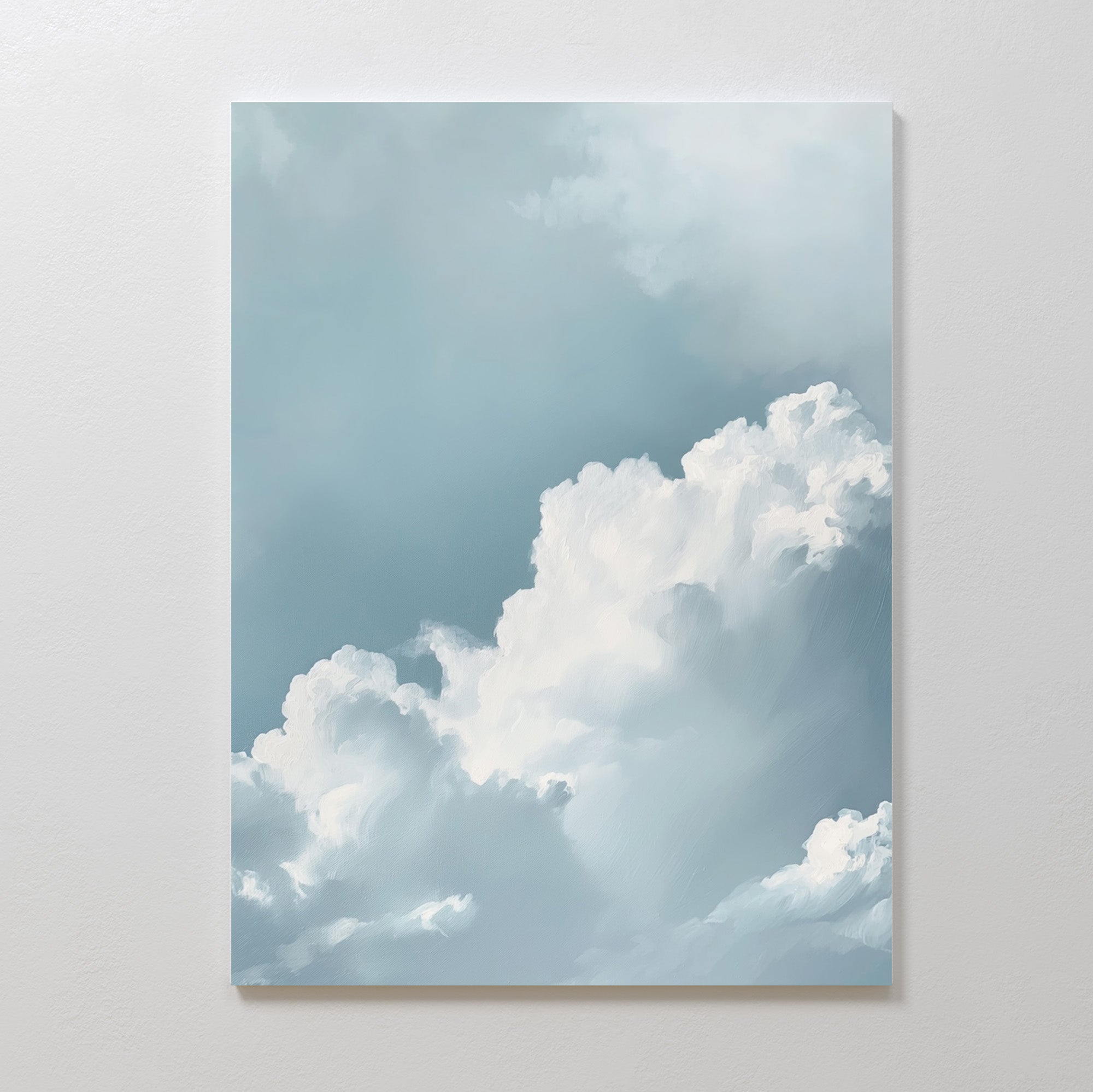 Sky Serenade Abstract Canvas Art features soft, fluffy white clouds against a light blue sky on a plain white wall, adding a serene, airy touch to your living room decor with its minimalist design.
