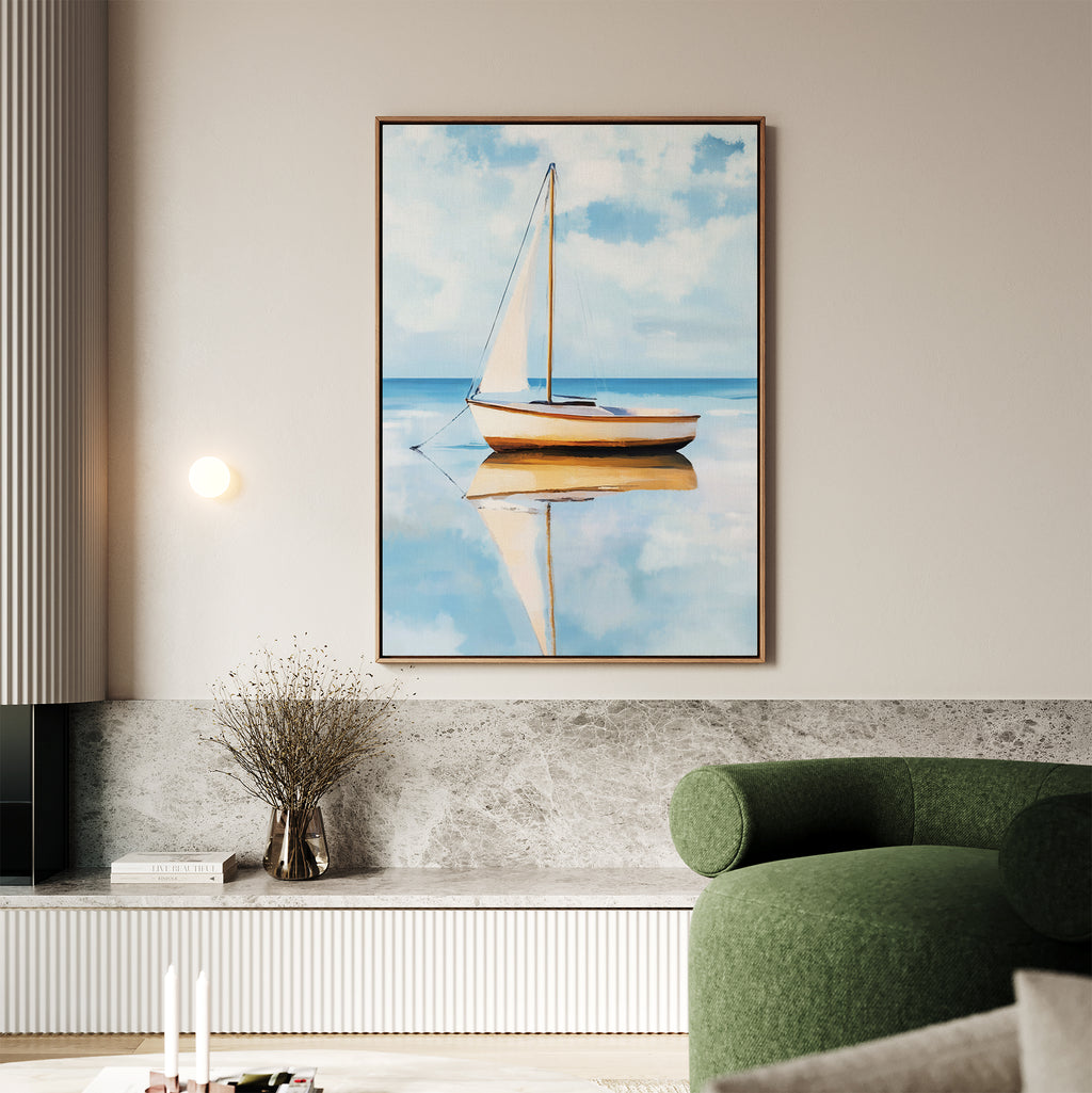 The Skybound Reflection Canvas Art, a framed minimalist sailboat scene, hangs on a beige wall above a light-toned ledge with dried flowers, complemented by a green armchair in this modern minimalist living room.