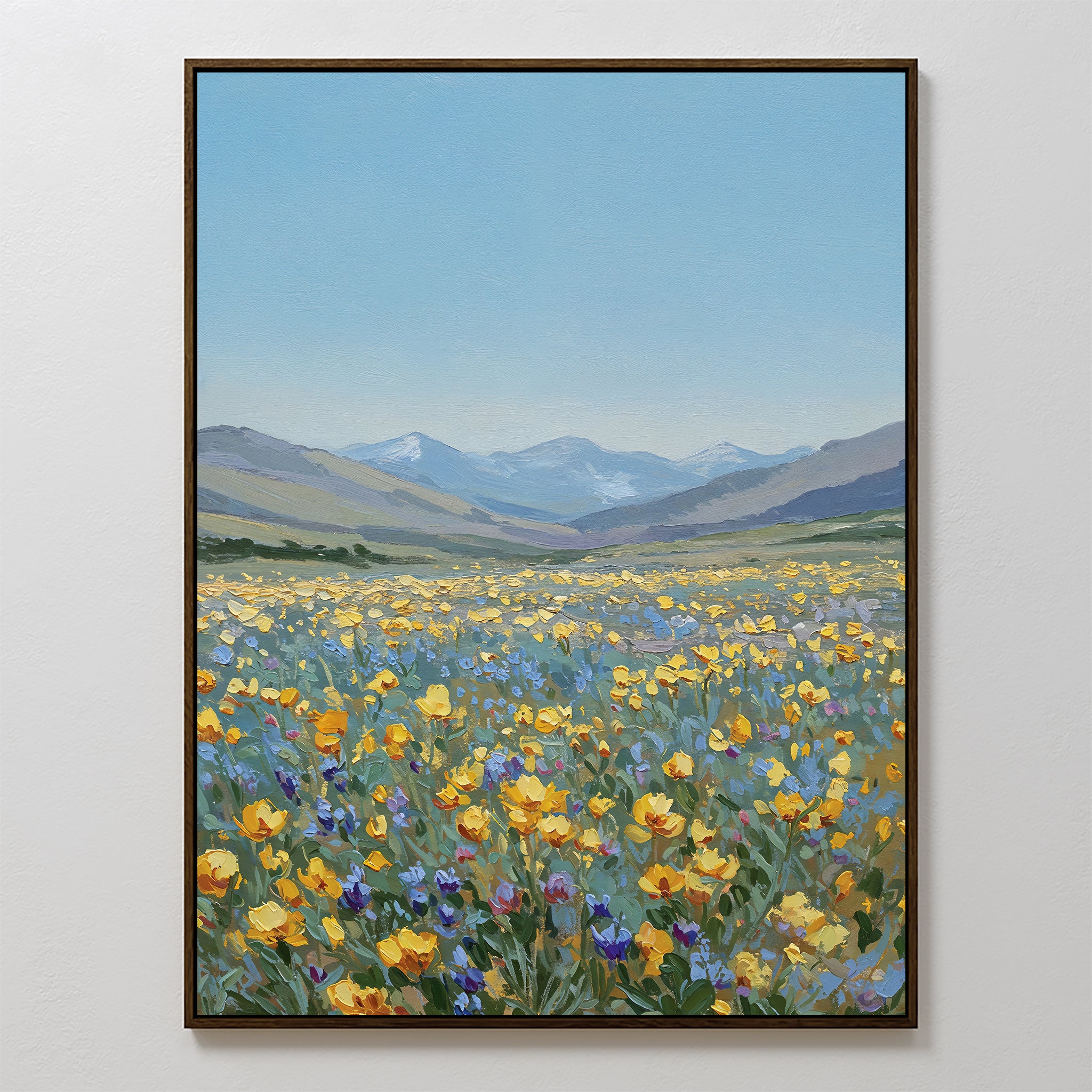 Skyview Field Canvas Art features a vibrant wildflower meadow with yellow, orange, and purple blooms beneath a blue sky and distant mountains—ideal large wall art to add color and charm to your bedroom decor.