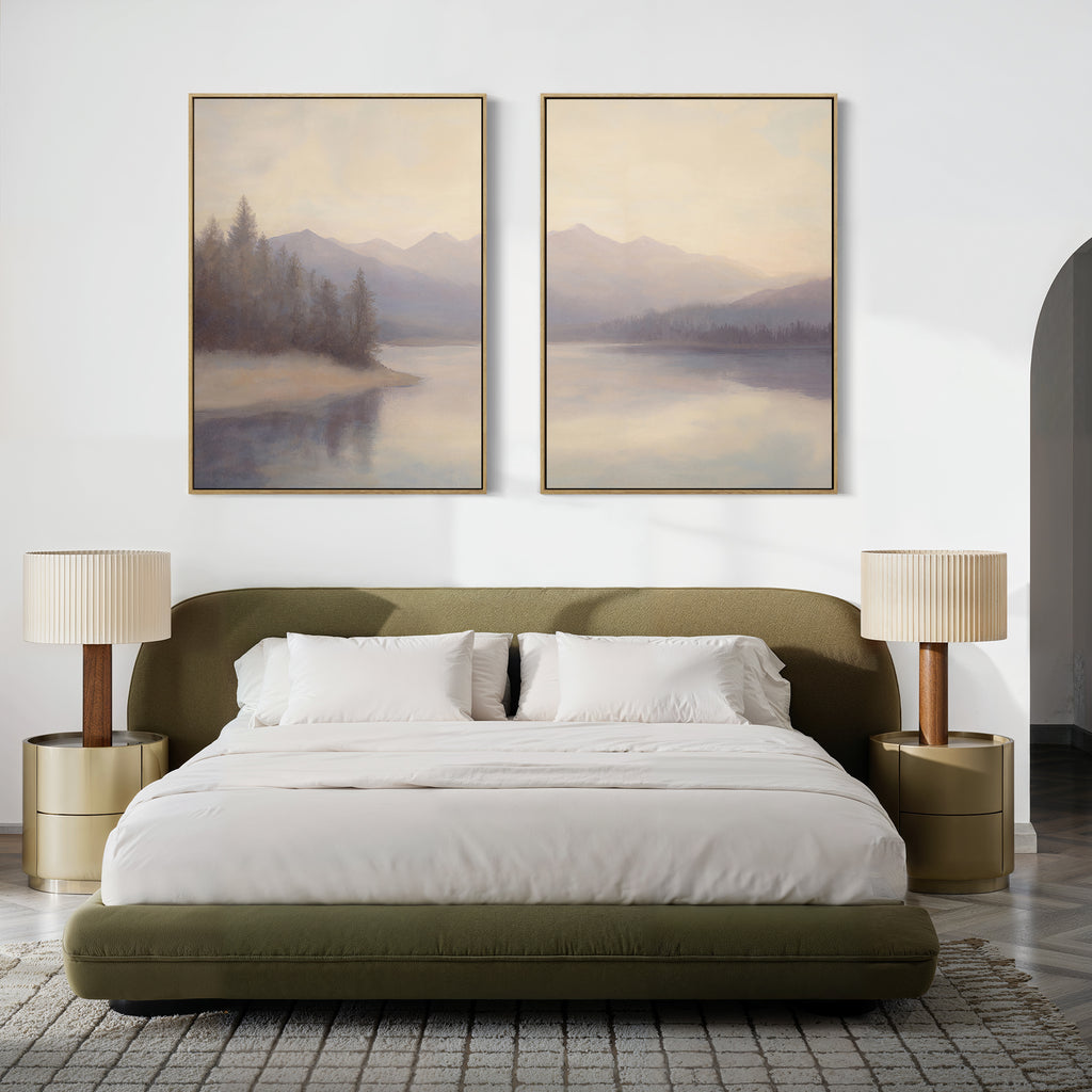 Modern bedroom with a low olive-green bed, white bedding, gold nightstands with beige lamps, and the Smoky Peaks Set of 2 landscape canvas prints above the bed on a crisp white wall.