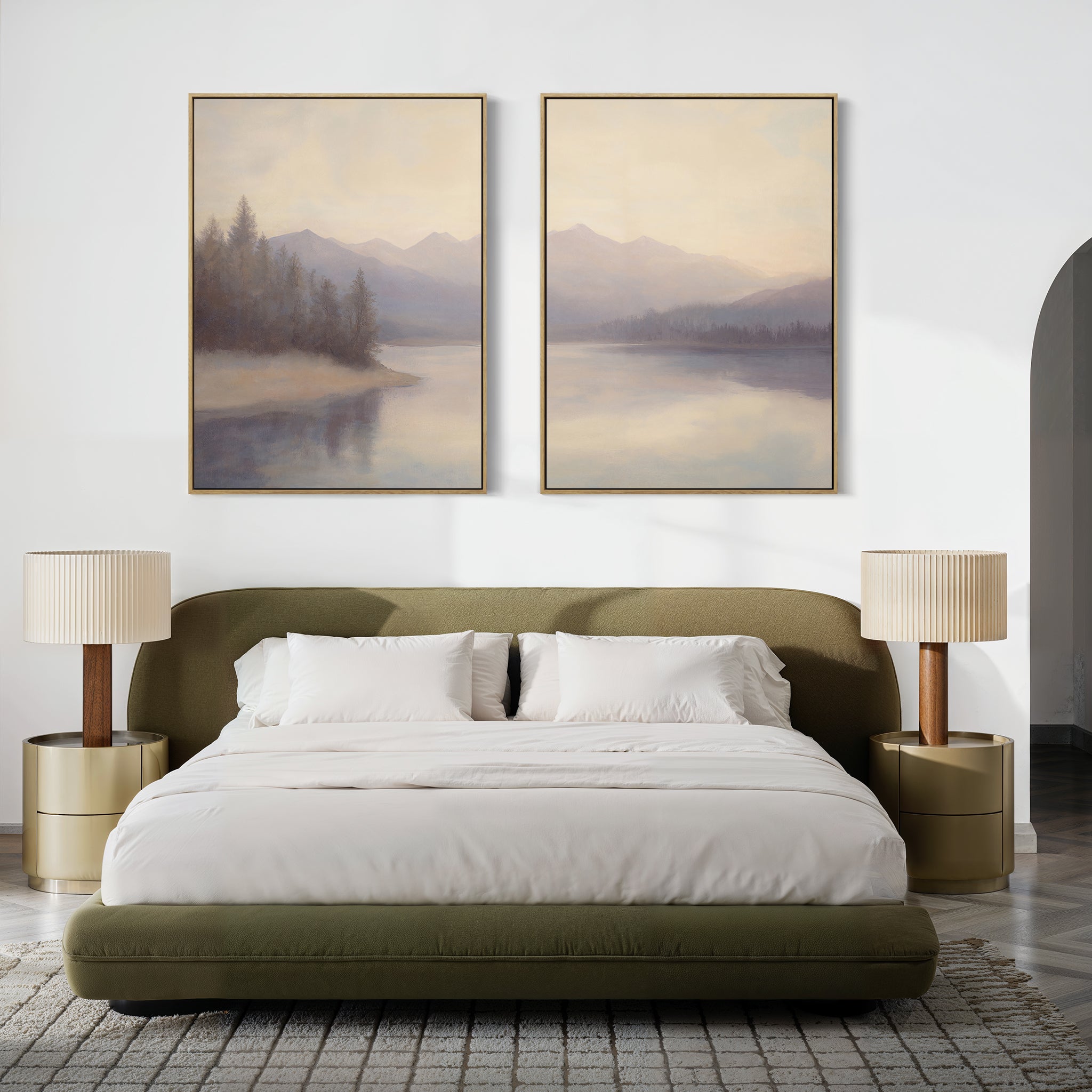 Modern bedroom with a low olive-green bed, white bedding, gold nightstands with beige lamps, and the Smoky Peaks Set of 2 landscape canvas prints above the bed on a crisp white wall.
