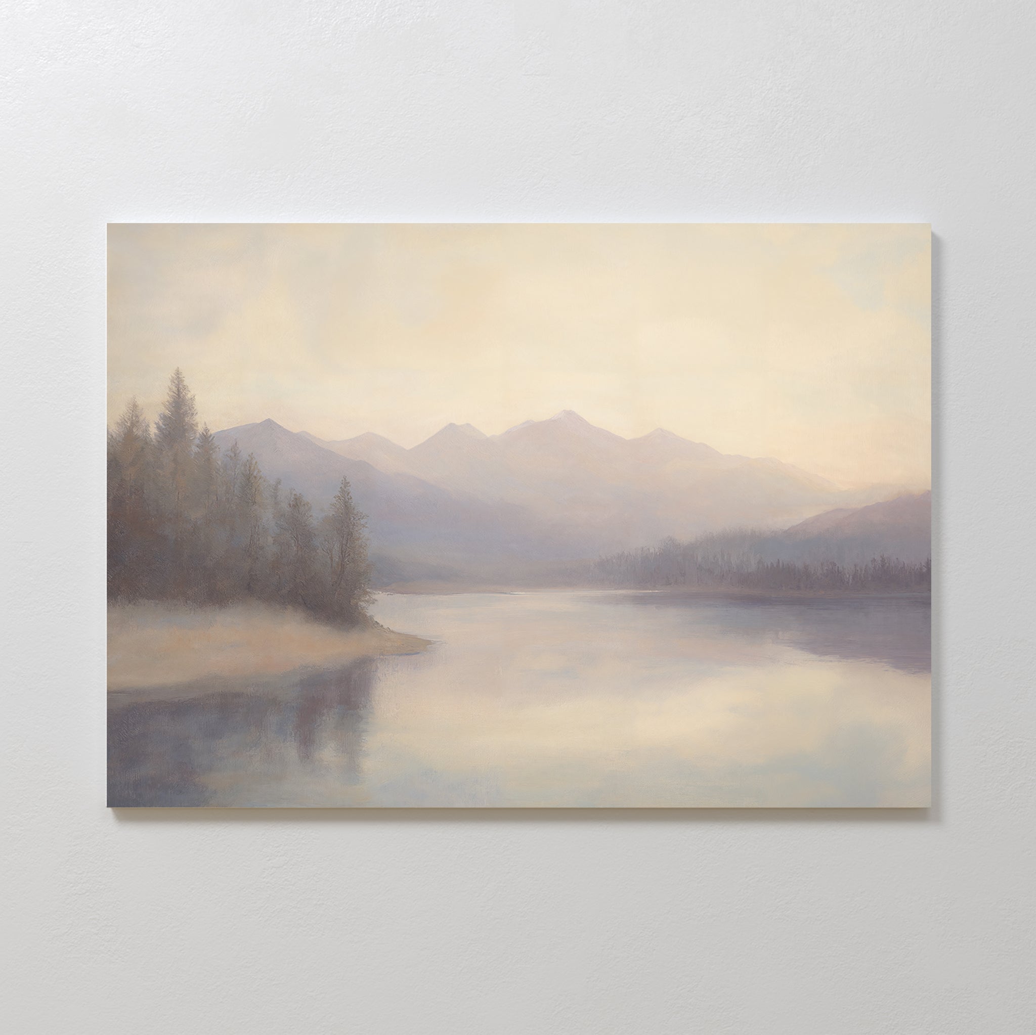 Smoky Peaks Canvas Art features a soft, pastel landscape of calm water reflecting distant mountains and trees under a hazy sky, adding a serene touch to any space—ideal for vintage decor or as an elegant print canvas.